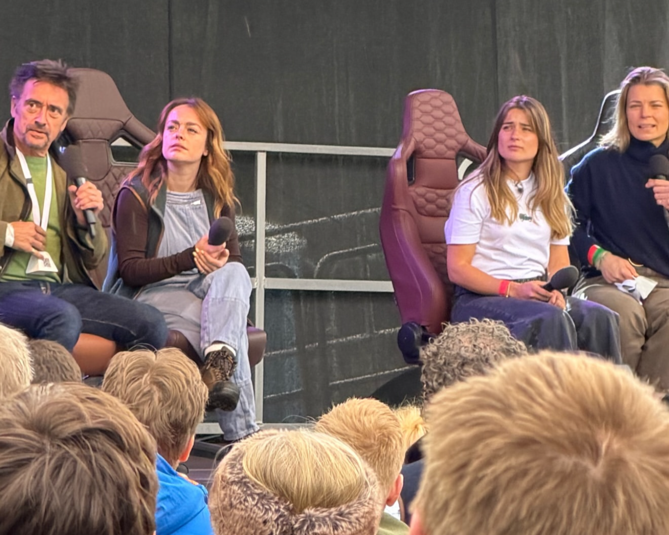 Richard Hammond, Izzy Hammond and Tati Reed sitting in LUCARI Leather Office Chairs on a stage