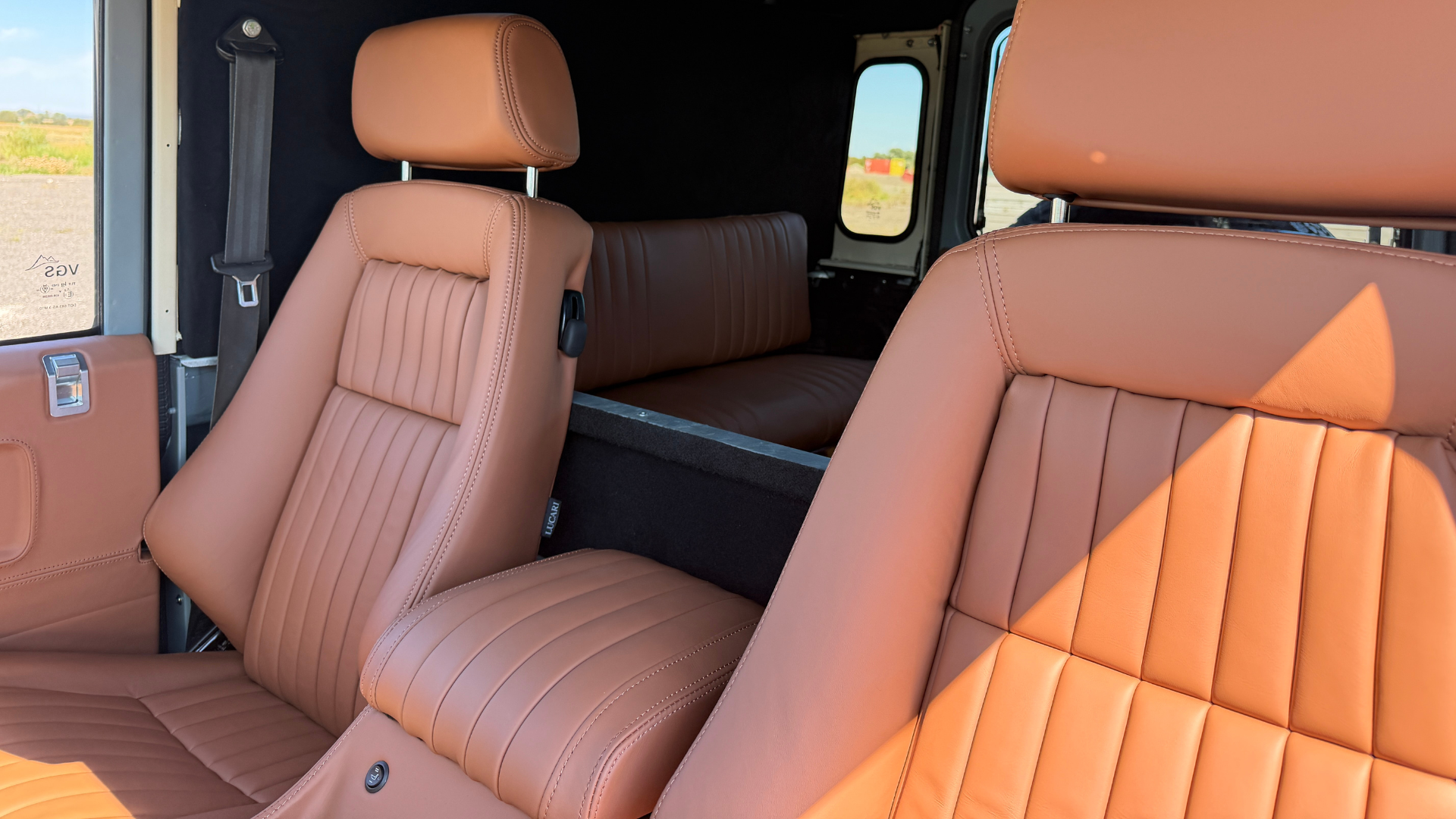 Defender front seats retrimmed in tan leather