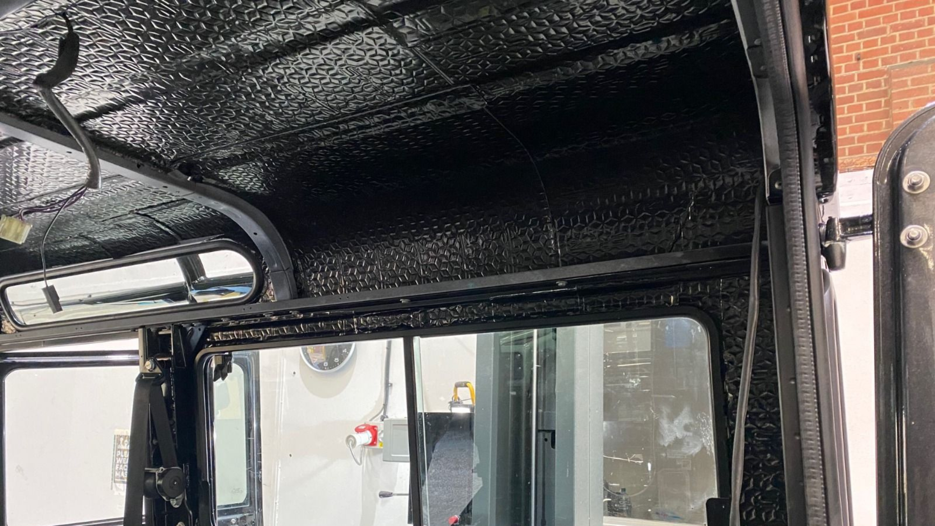 Defender roof lining stripped back to show Soundskins sound deadening fitted to the interior panels.